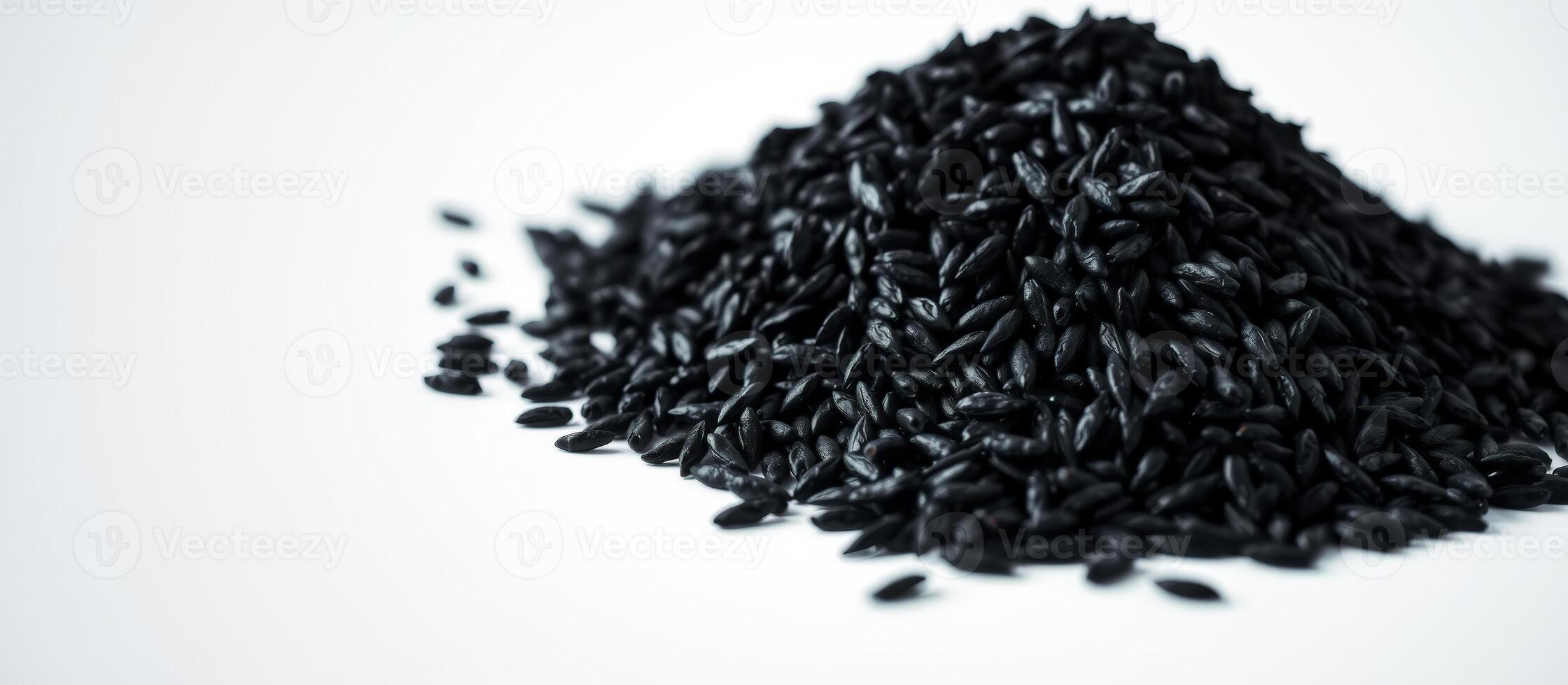 Black Rice Pile on White Background photo