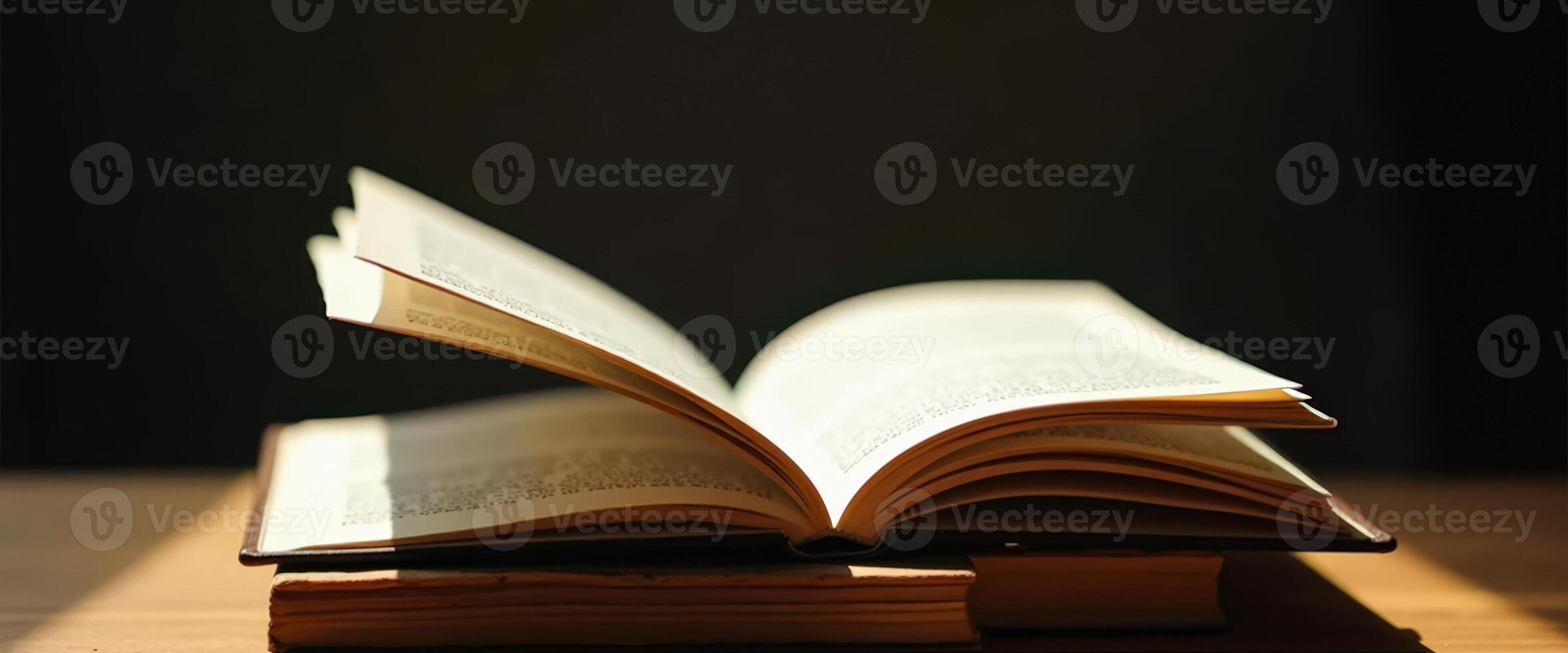 Open Book on a Wooden Table photo