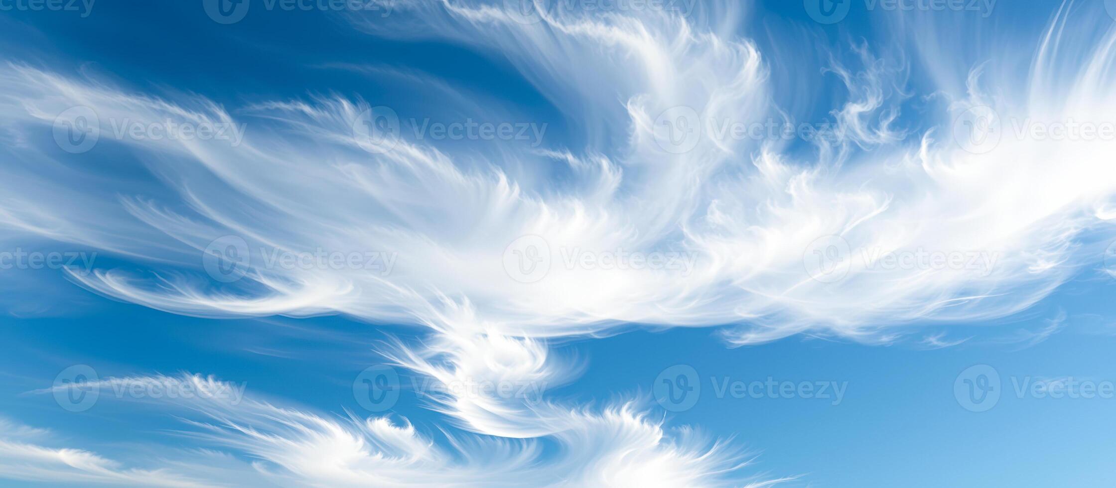 White Feathery Clouds in Blue Sky photo