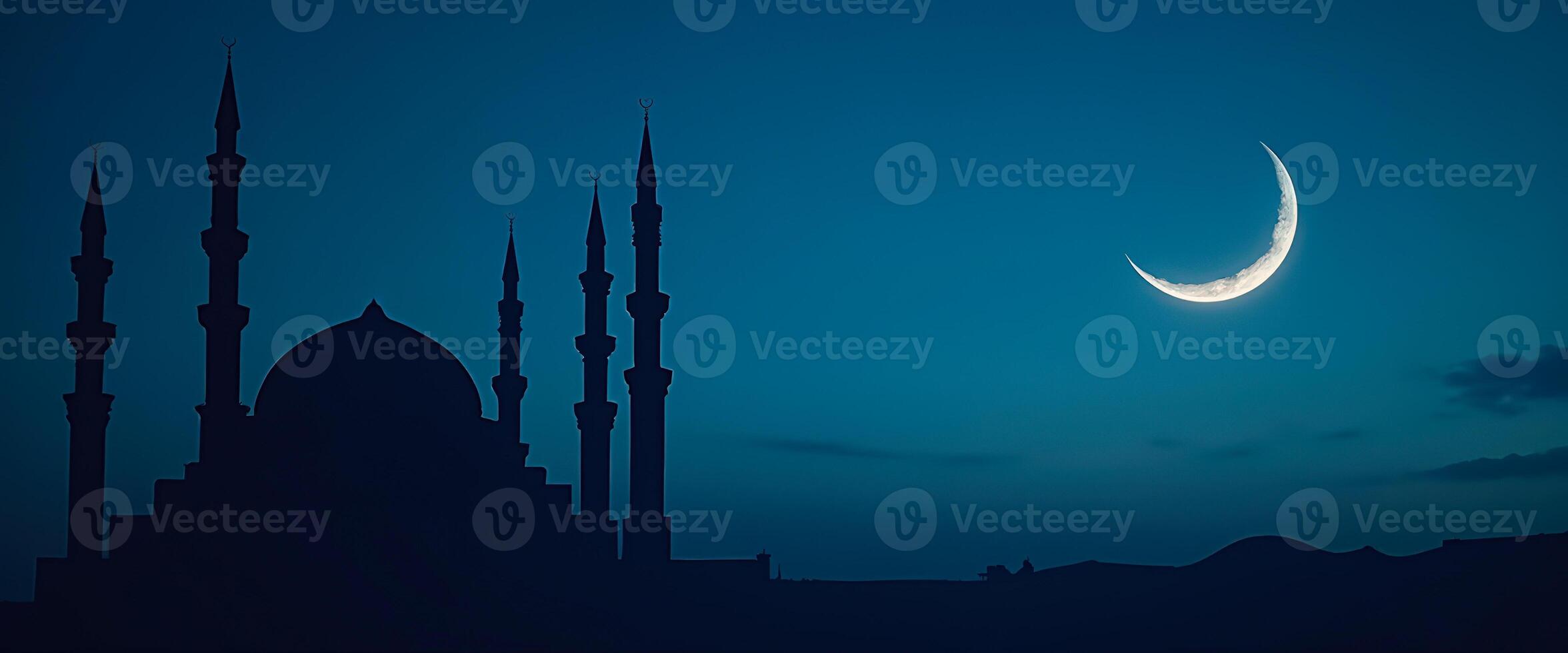 Silhouette of a mosque with a crescent moon in the sky photo