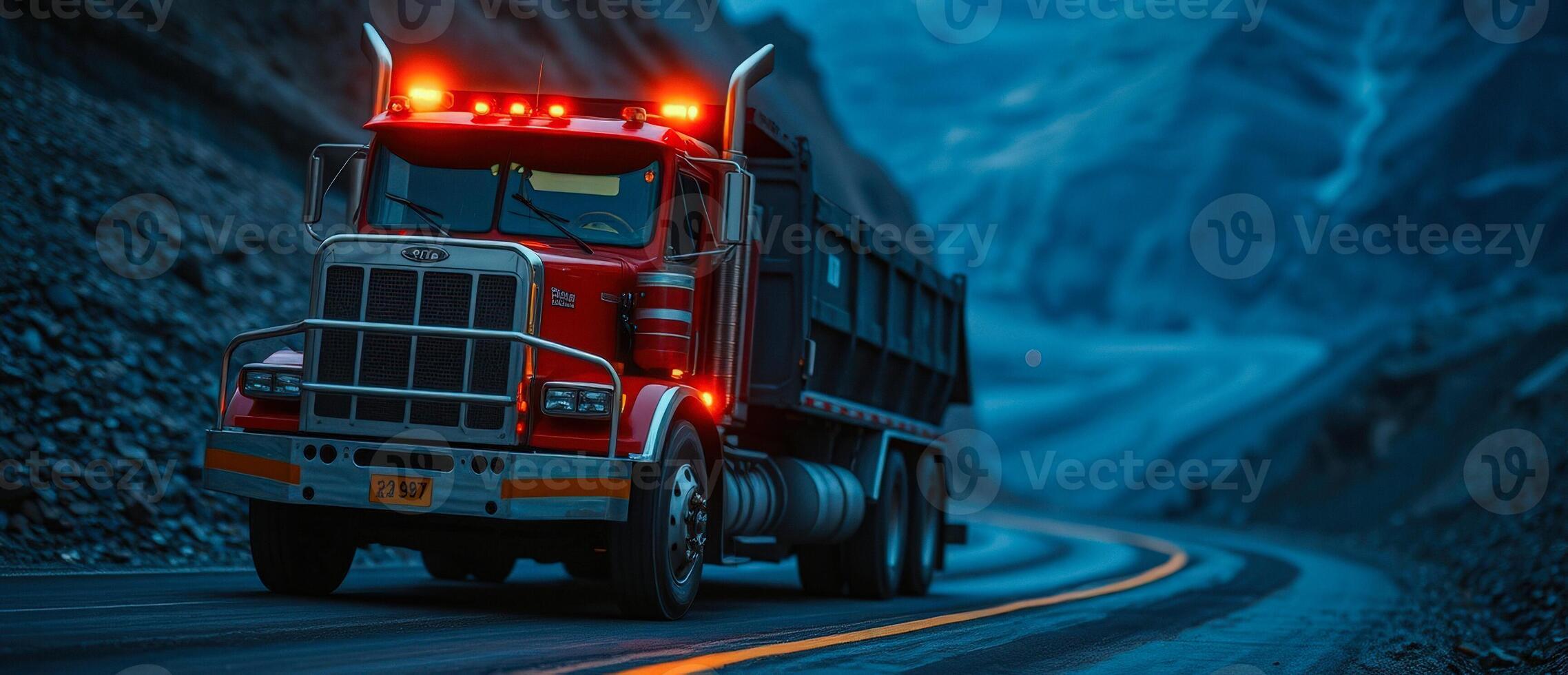 Red Semi-Truck on Winding Road in the Mountains photo