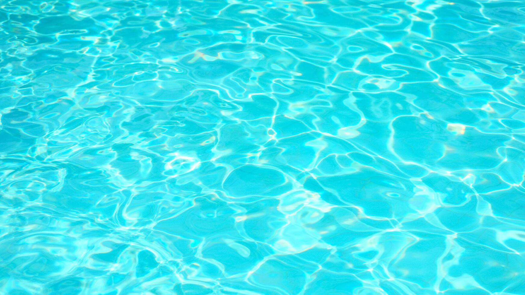 Swimming Pool Surface With Light Reflection and Water Ripple Patterns photo