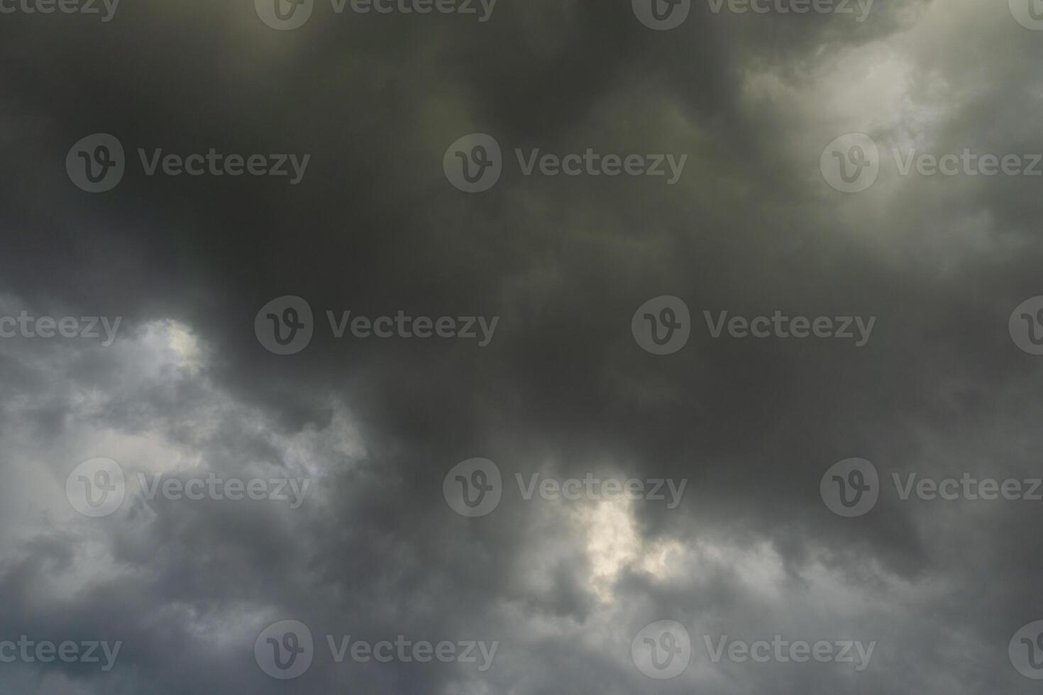 background of dark clouds during the day, with beautiful gray and rainbow colors photo