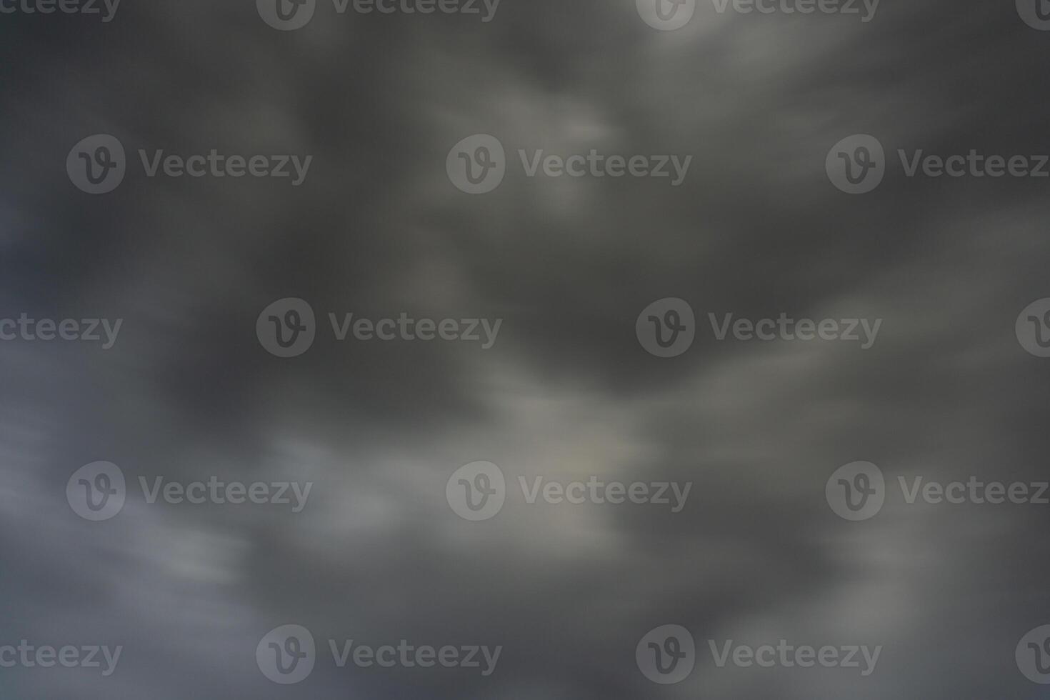 background of dark clouds during the day, with beautiful gray and rainbow colors photo