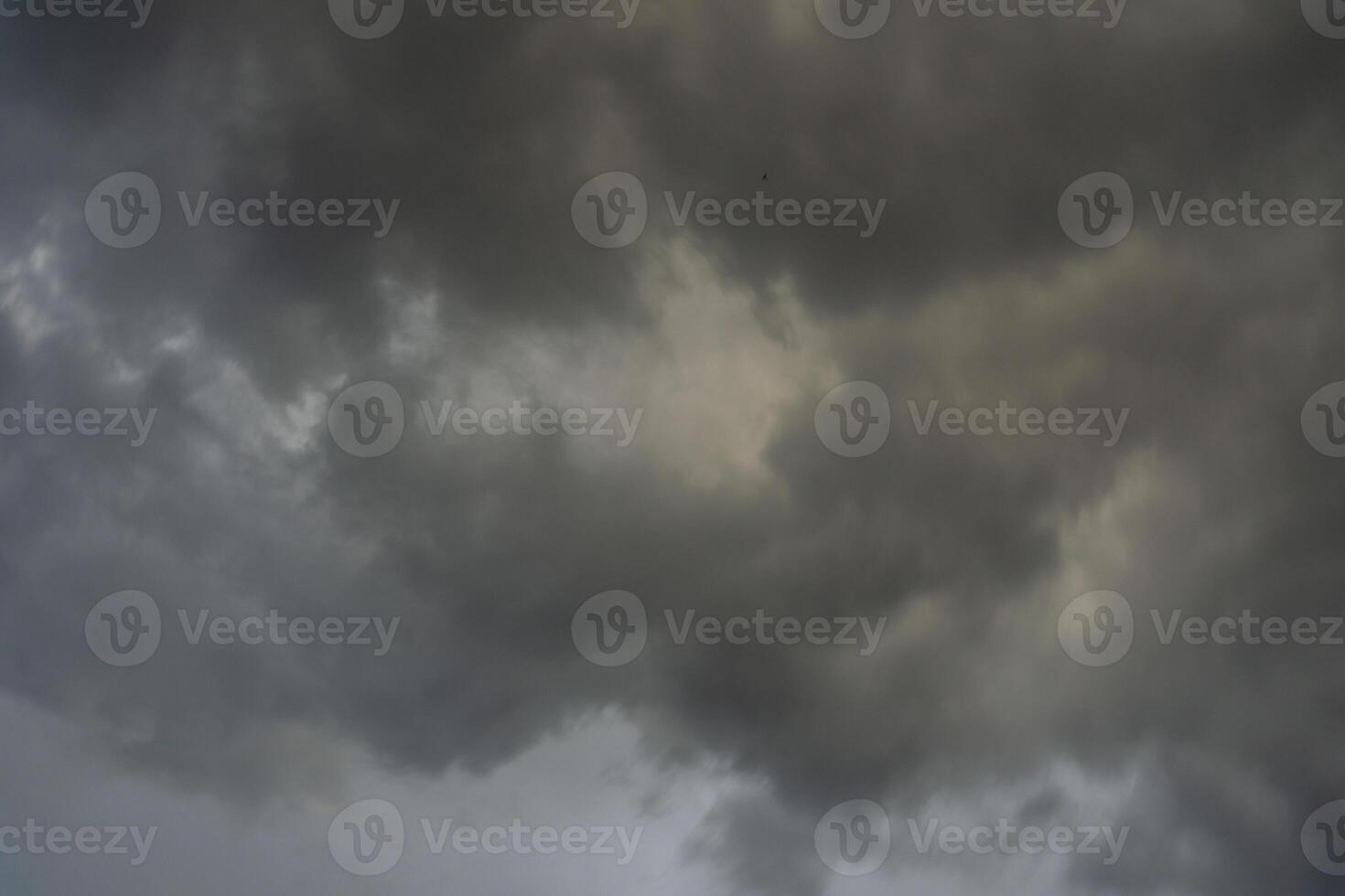background of dark clouds during the day, with beautiful gray and rainbow colors photo