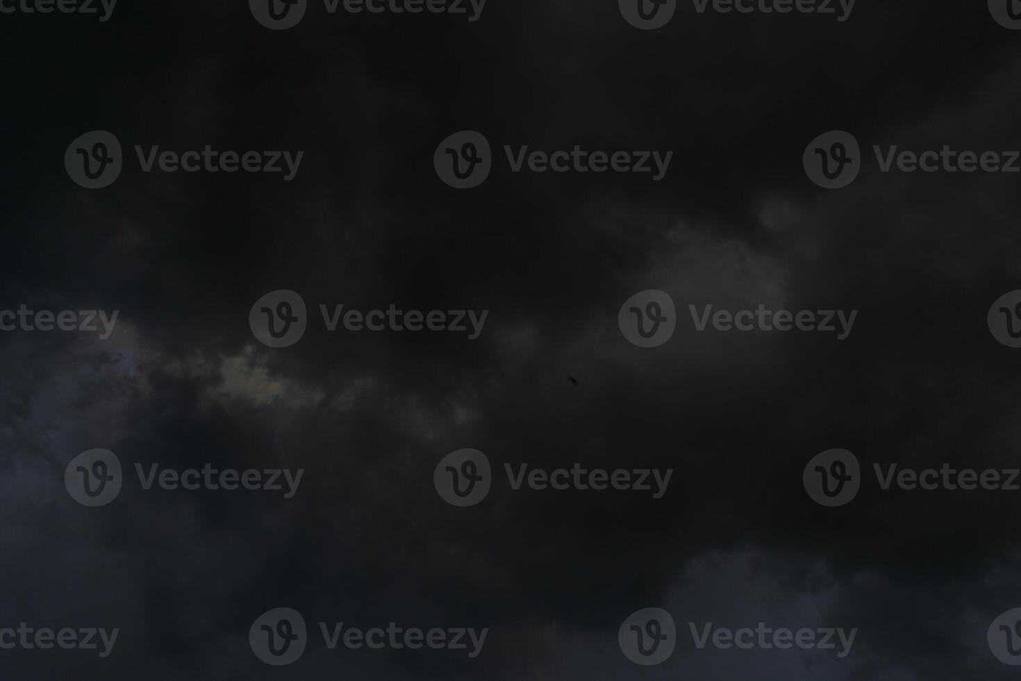 background of dark clouds during the day, with beautiful gray and rainbow colors photo