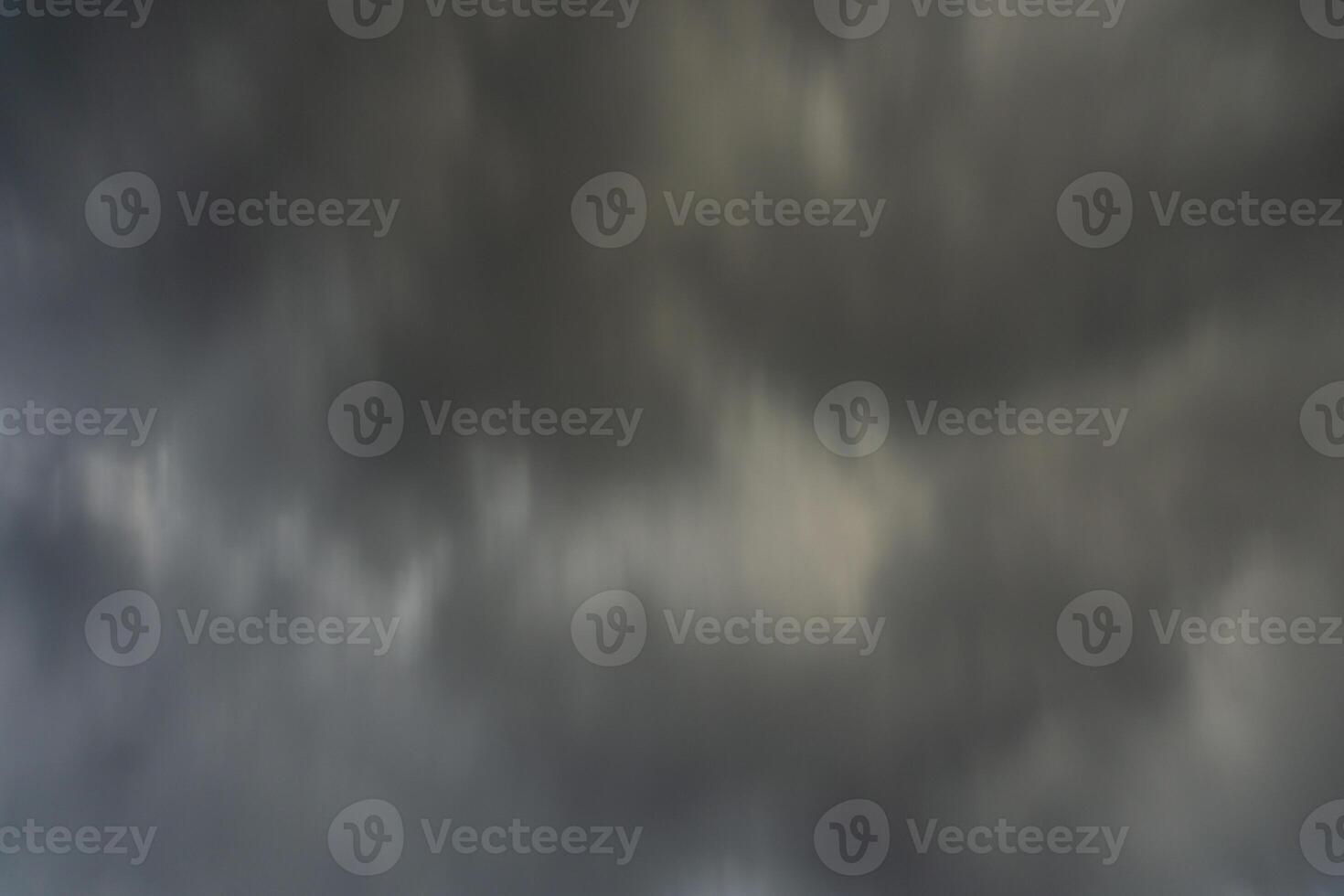 background of dark clouds during the day, with beautiful gray and rainbow colors photo
