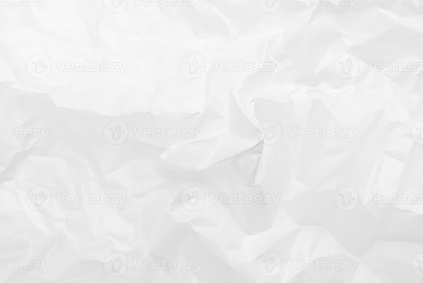 Close-up of crumpled white tissue paper texture, ideal for use in design, backgrounds, and abstract art projects. photo