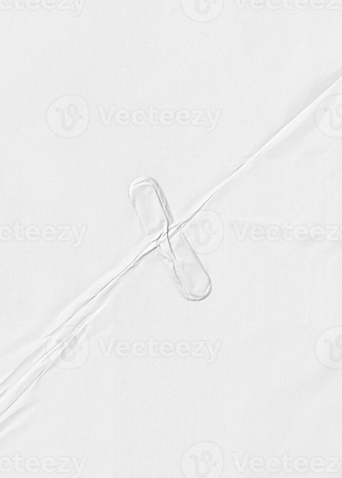 High-resolution white paper texture featuring subtle creases and folds, ideal for backgrounds, design, and overlays. photo