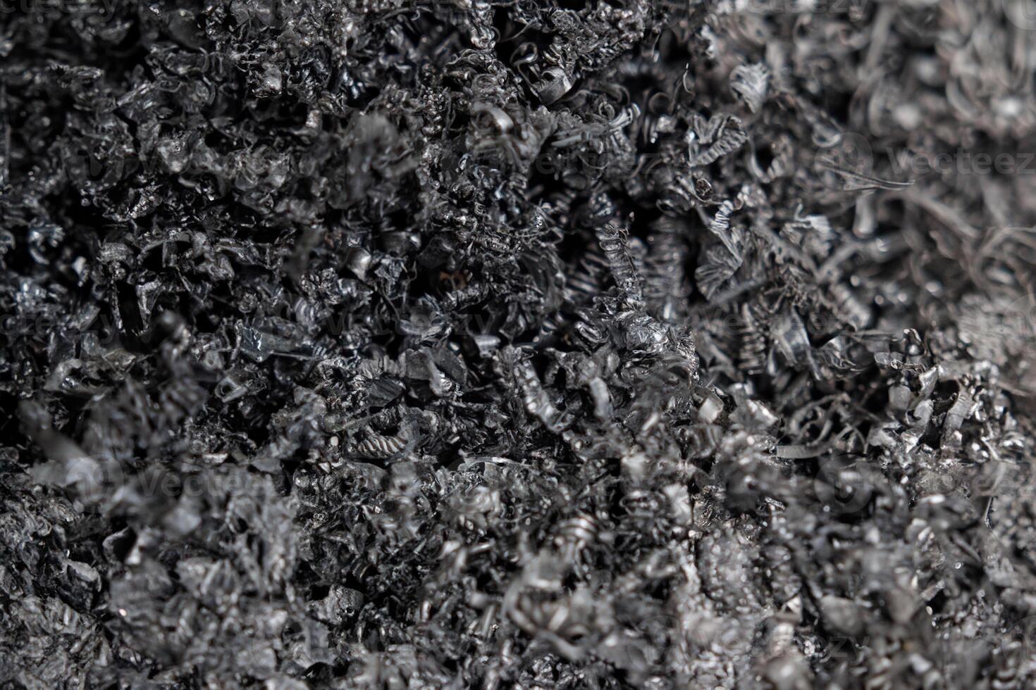 Close-up of Metal and Plastic Scraps from CNC Lathe Machine Turning Process photo