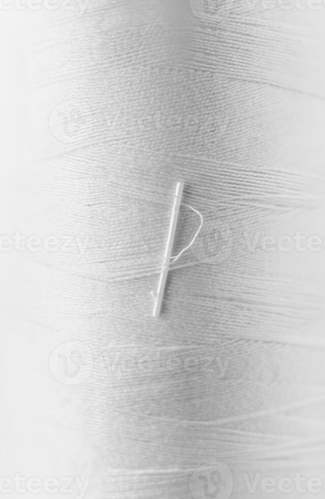 Close-up of White Thread Texture with Soft Fibers and Fine Lines photo