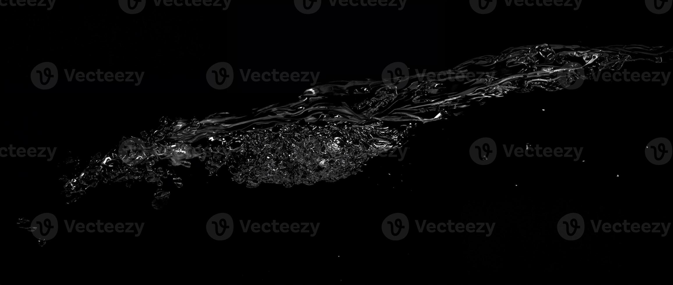 Seamless Water Surface Transition with Underwater and Above Water Contrast on Black Background photo