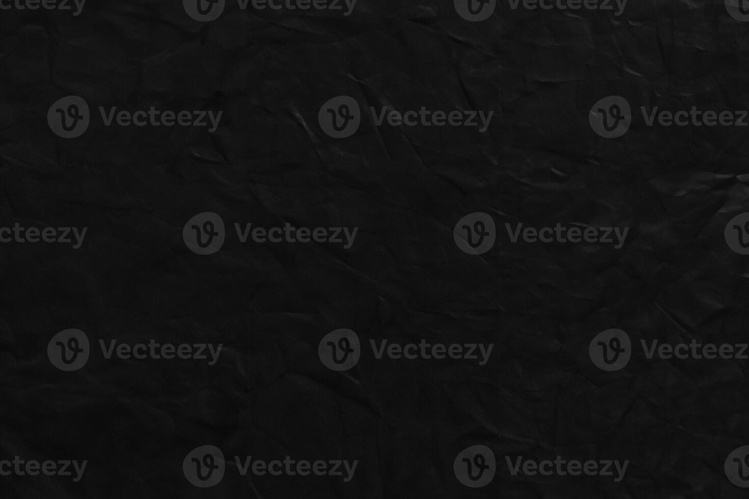 Close-up of Black Corduroy Fabric on Dark Background photo