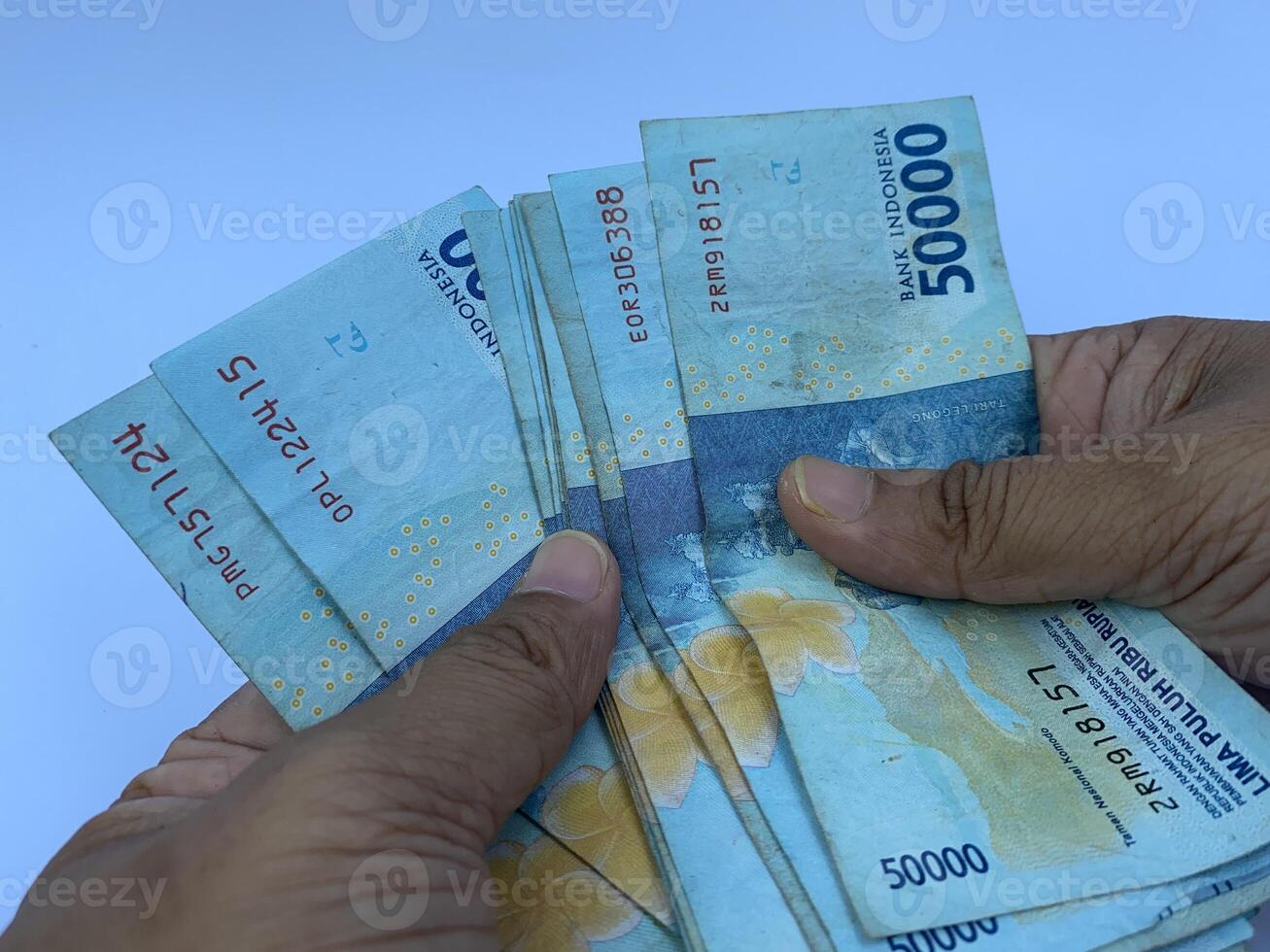 Hand Counting Indonesian Rupiah photo