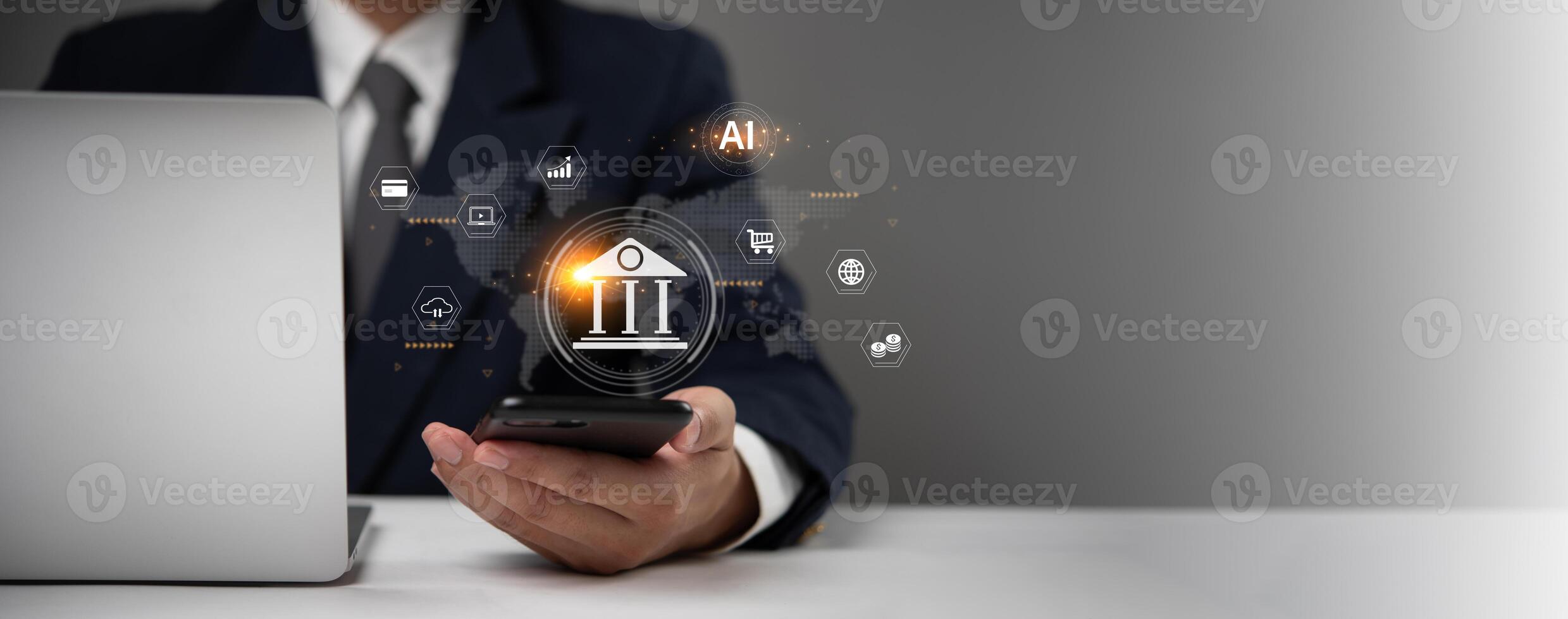 Businessman using smartphone and laptop with icons of banking and finance concept photo