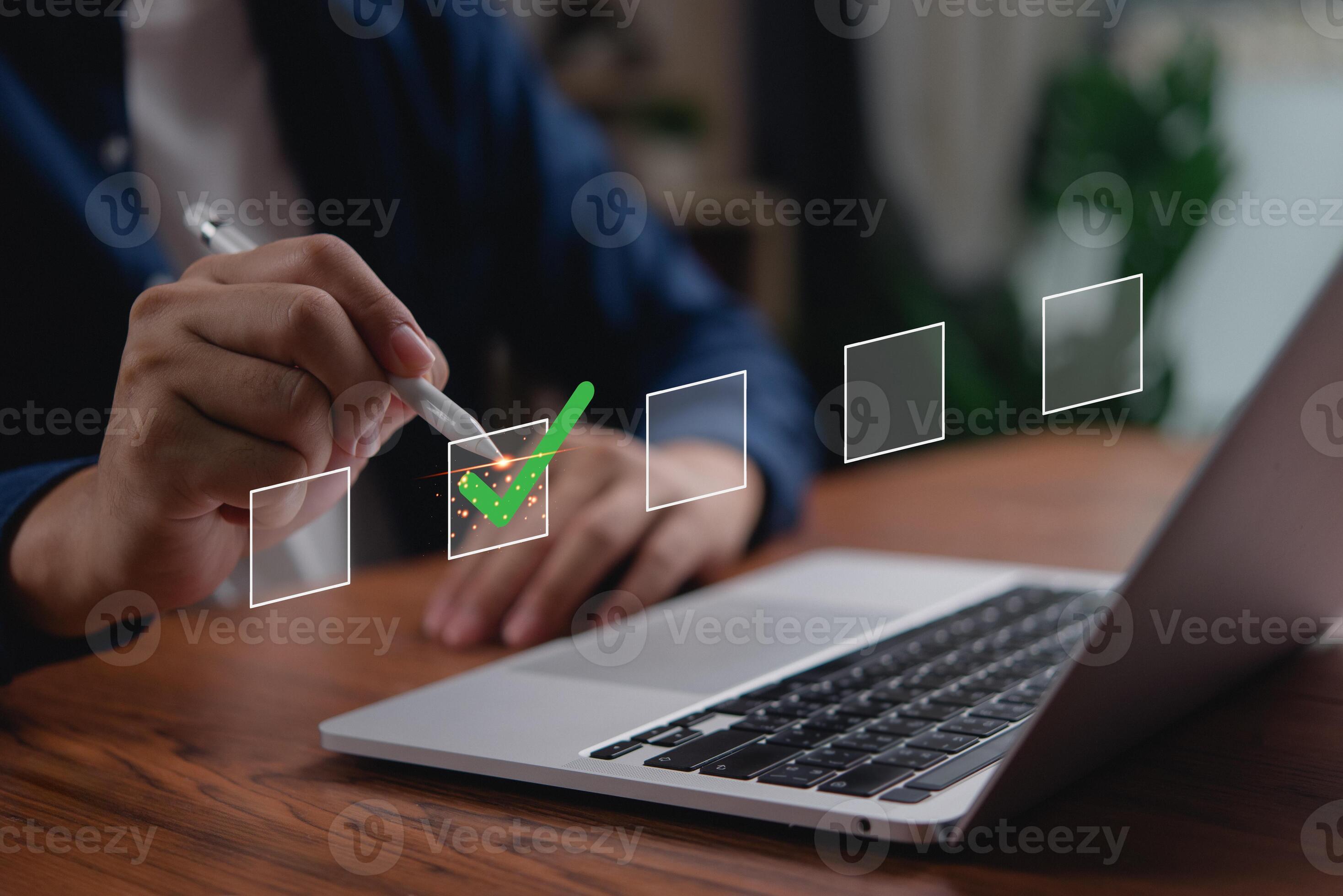Man writing check mark on laptop screen 50513970 Stock Photo at Vecteezy