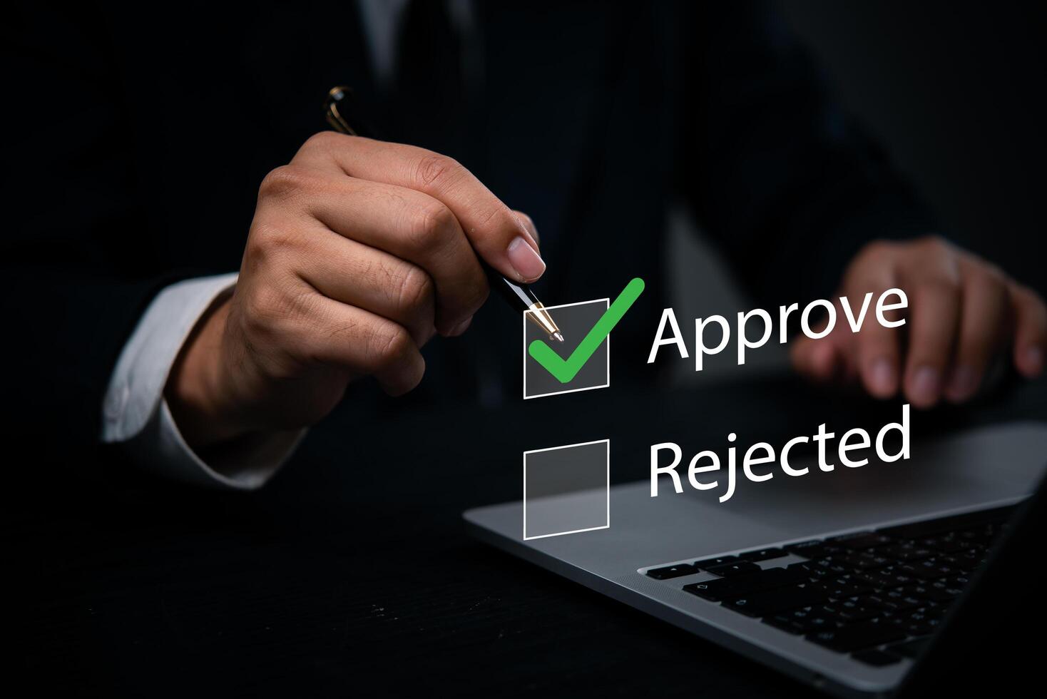 Hand with a pen marking approval on a digital checkbox laptop. management processes, corporate evaluations. Perfect for business approval workflows, quality control, and corporate assessments. photo