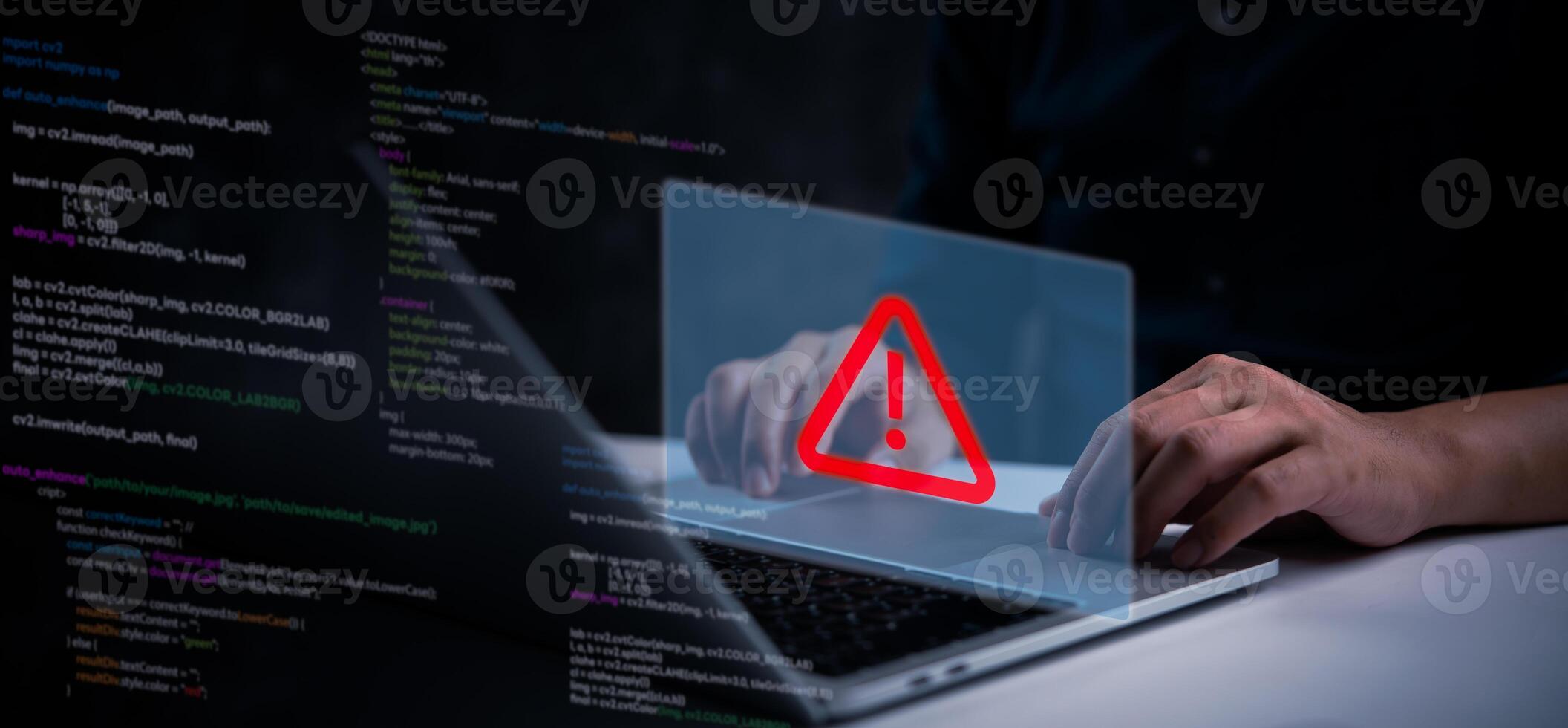 A man using a laptop with a red warning sign on it photo