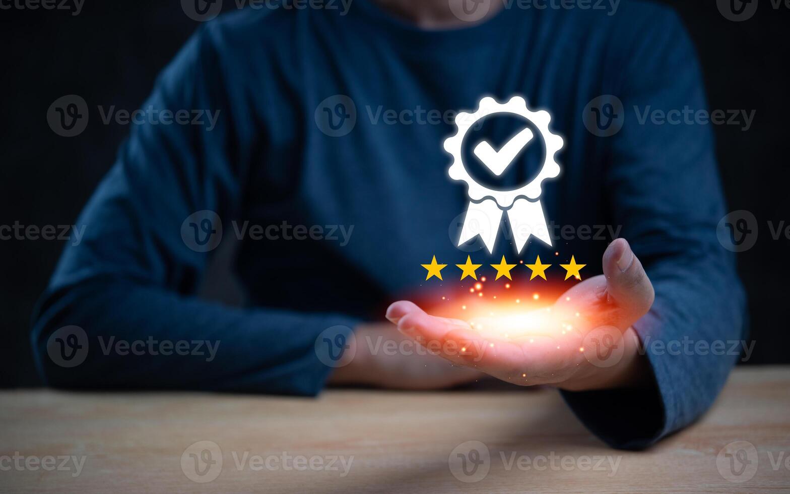 Hand holding a glowing five-star quality assurance badge with a checkmark. Represents excellence and certification. Perfect for quality control, customer satisfaction, and service standards. photo