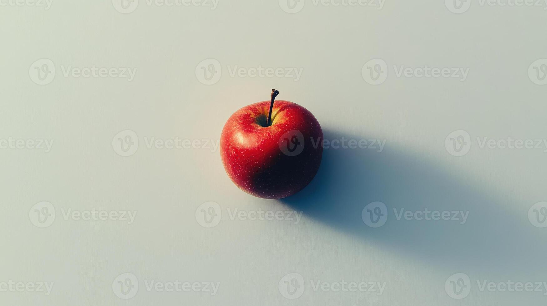Single Red Apple with Shadow on White Background photo