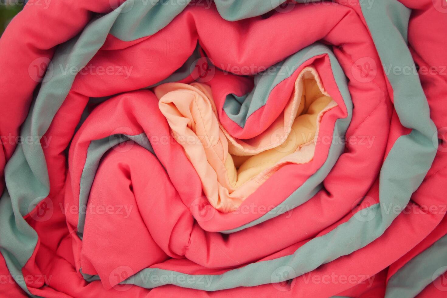 Discover Colorful Rolled Blankets Showcasing Vibrant Textiles for Your Living Space photo