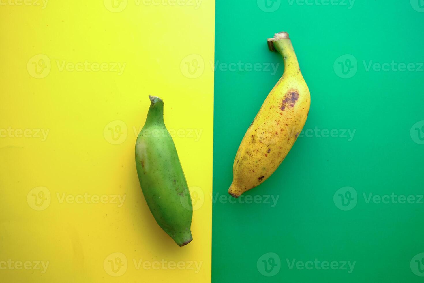 Fresh Bananas Both Green and Yellow on a Beautifully Vibrant Background Full of Color photo