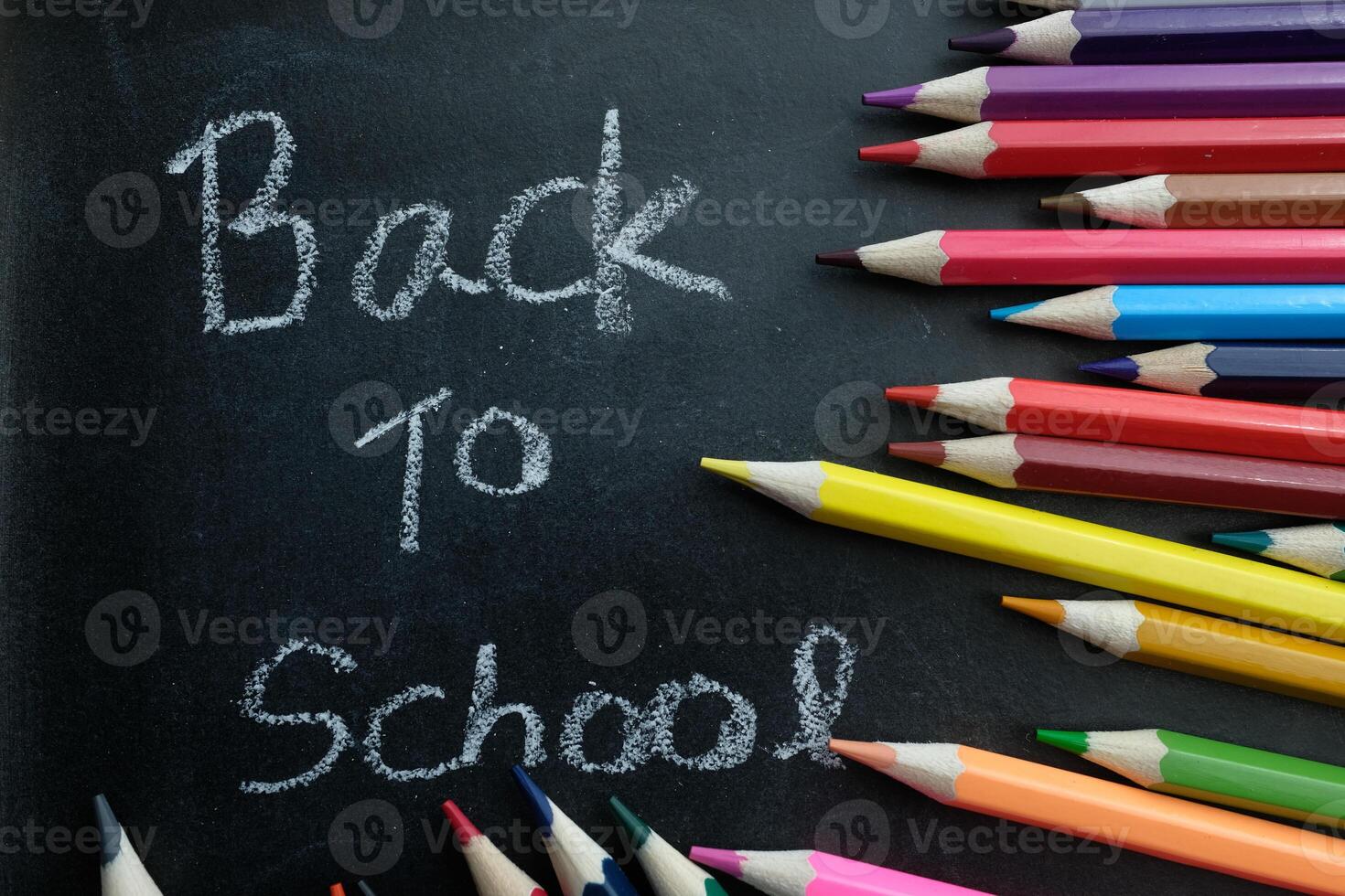 A vibrant Back to School artwork with a charming chalkboard and colorful crayons scattered photo