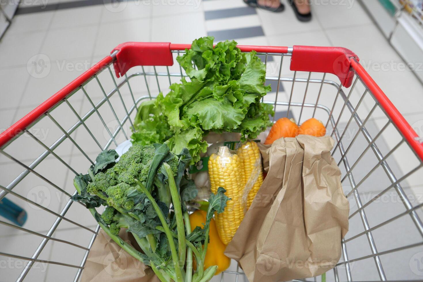 Fresh and Delicious Vegetables and Fruits Loaded in the Shopping Cart for Healthy Eating photo