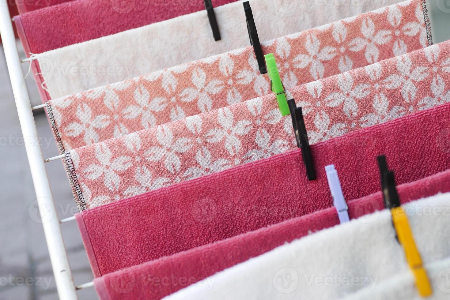 towels hang on the clothesline with clothespins photo