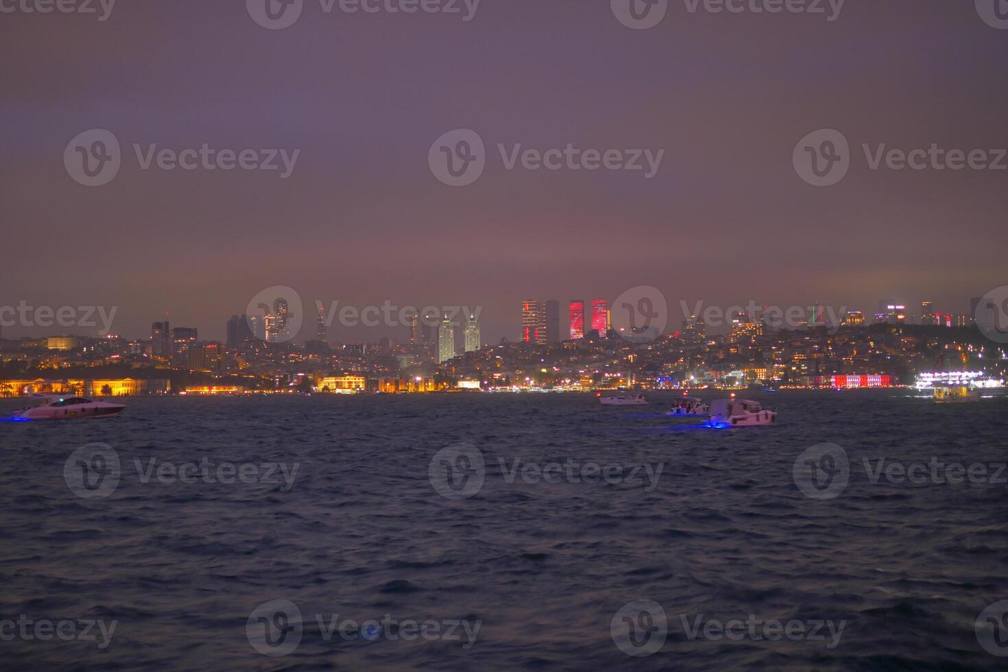 The Stunning Istanbul Night Skyline Features a Beautiful Display of Glowing Lights Over Water photo