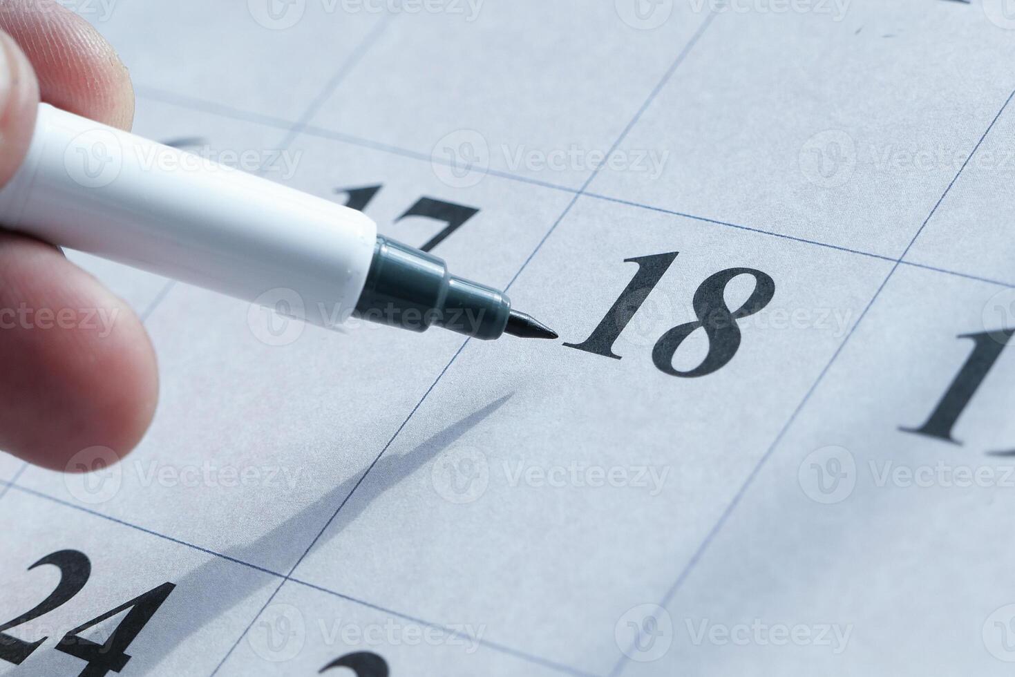 Remember to mark an important date on your calendar using a marker pen for visibility photo
