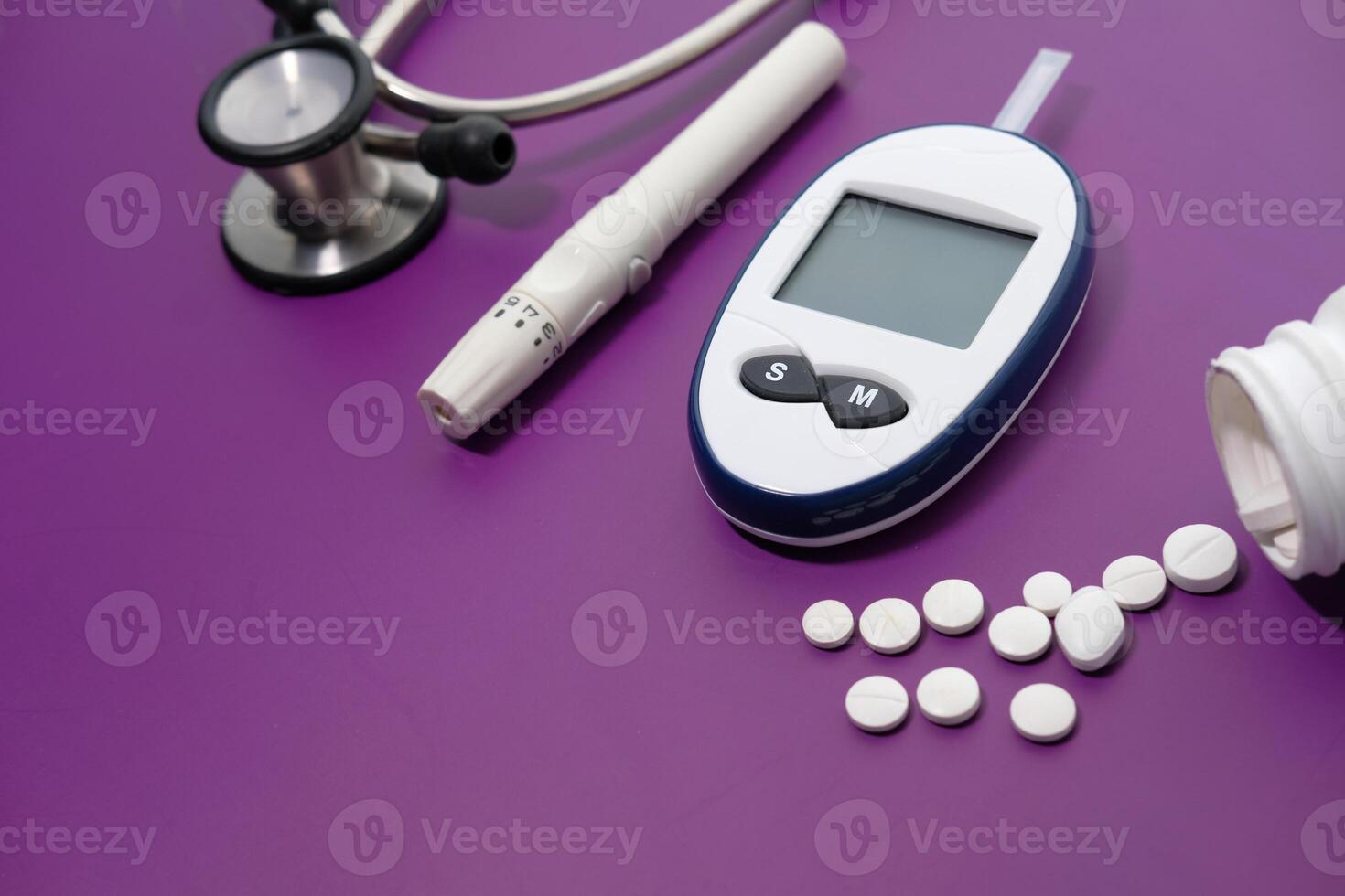 Essentials for Managing Diabetes Effectively Stethoscope, Glucometer, and Medication are Vital photo