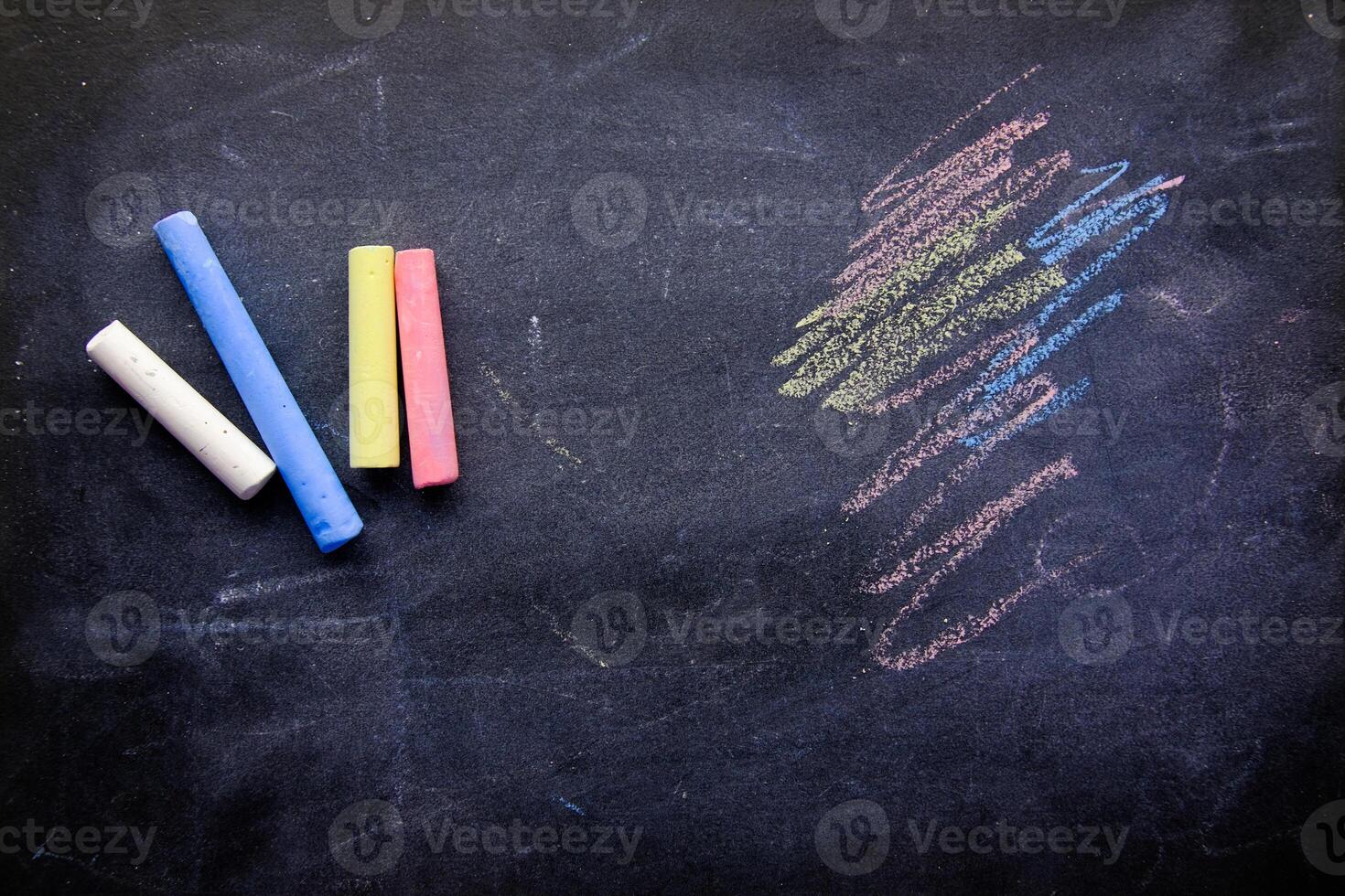 Colorful Chalk on a Smooth Black Chalkboard Surface That Invites Creativity and Fun photo