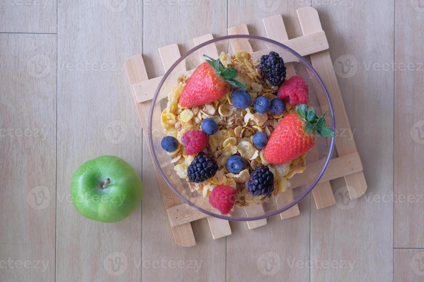 A Vibrant and Colorful Fruit and Cereal Breakfast Bowl Featuring a Crisp Green Apple photo
