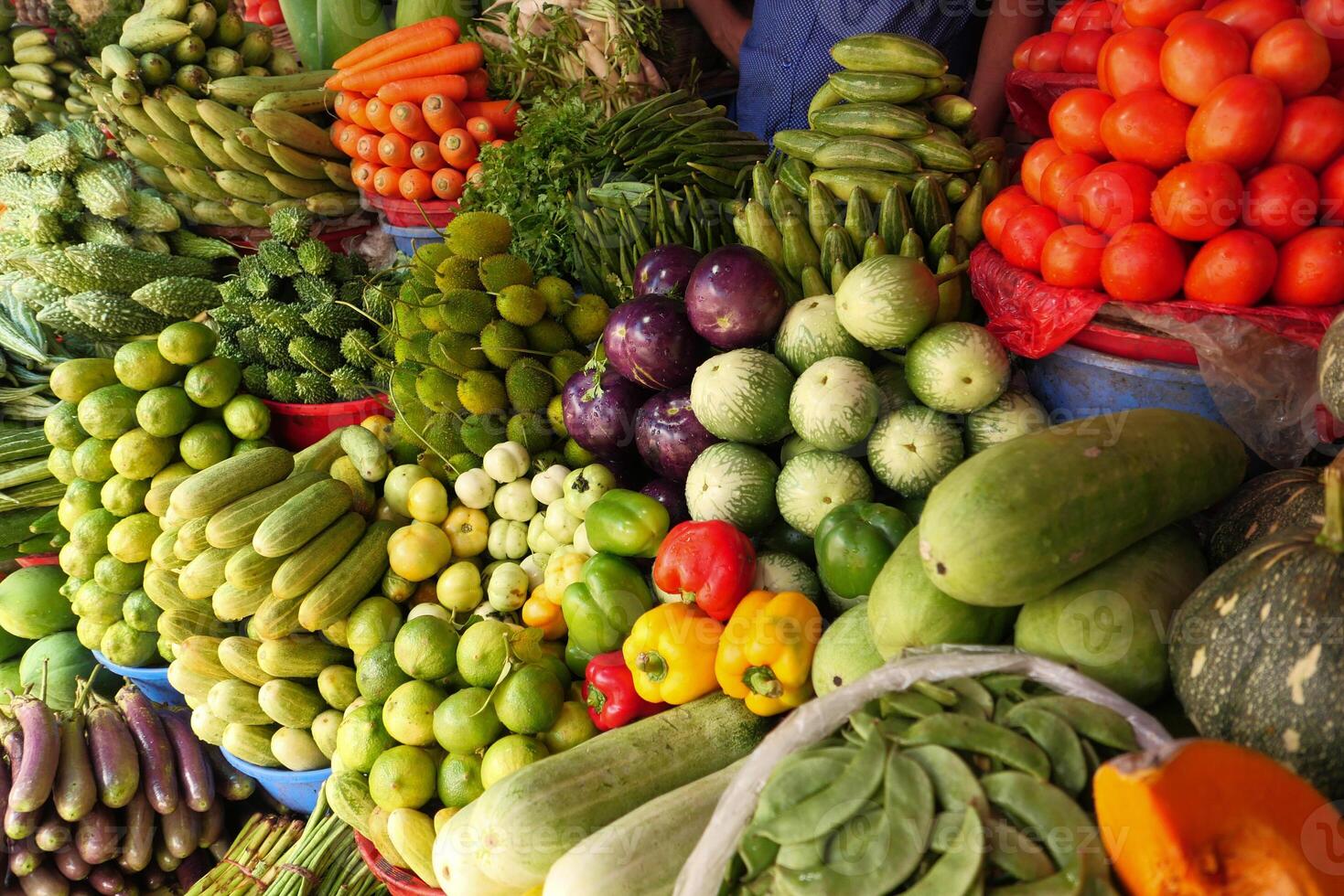 A Vibrant Market Scene Featuring an Abundance of Fresh Fruits and Vegetables of All Types photo
