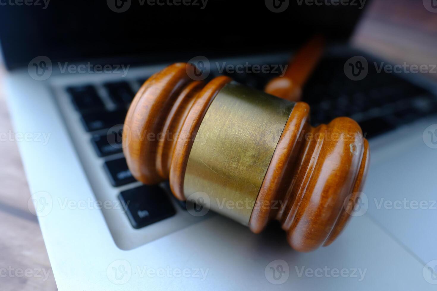 A Law Gavel on a Laptop Keyboard symbolizes Justice and technology in the Legal field photo