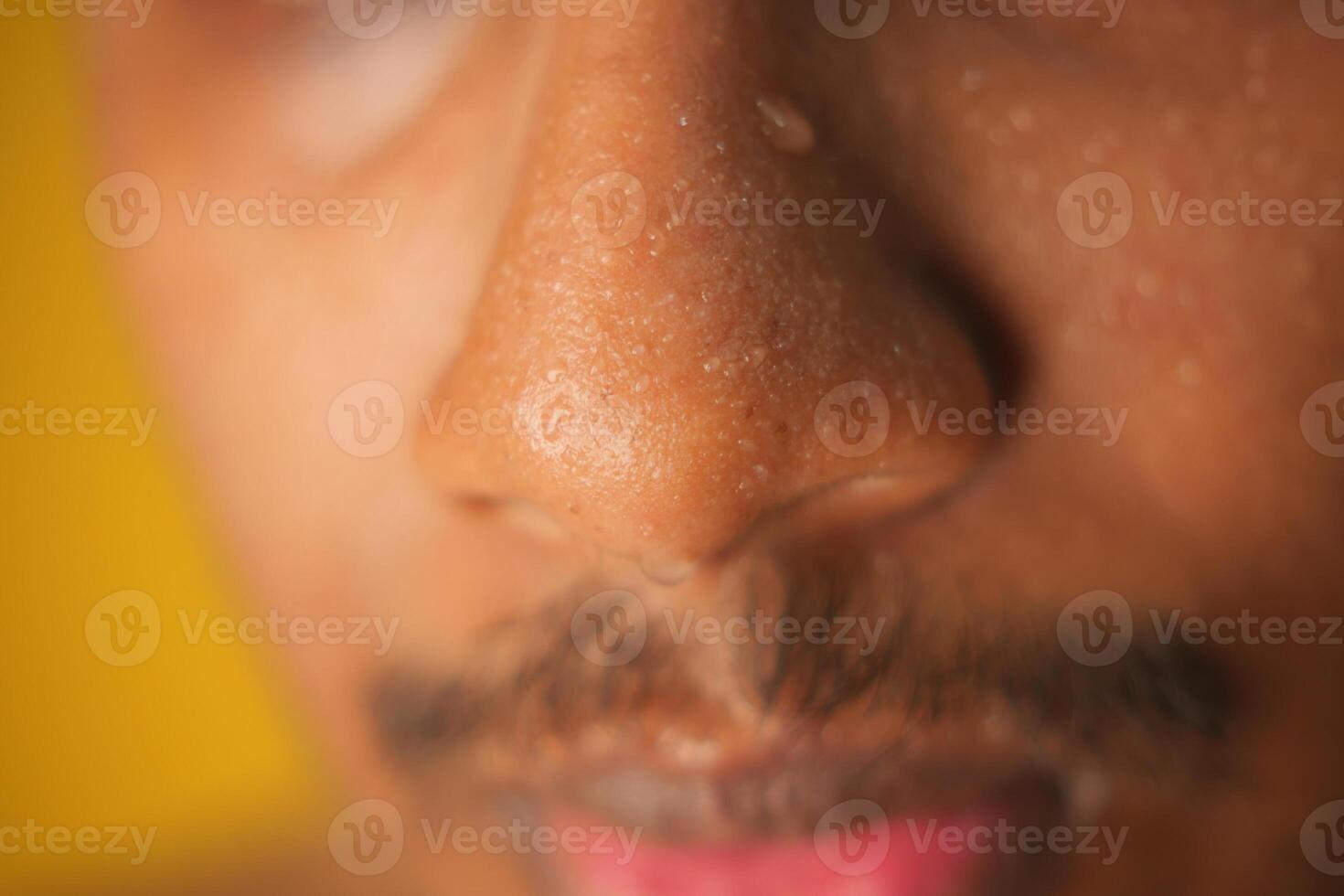 closeup of sweat on man nose photo