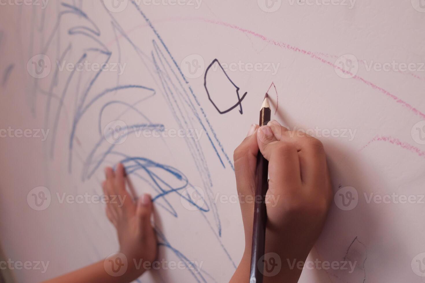 A Childs Creative and Imaginative Drawing on the Wall Featuring Colorful Sketches and Art photo