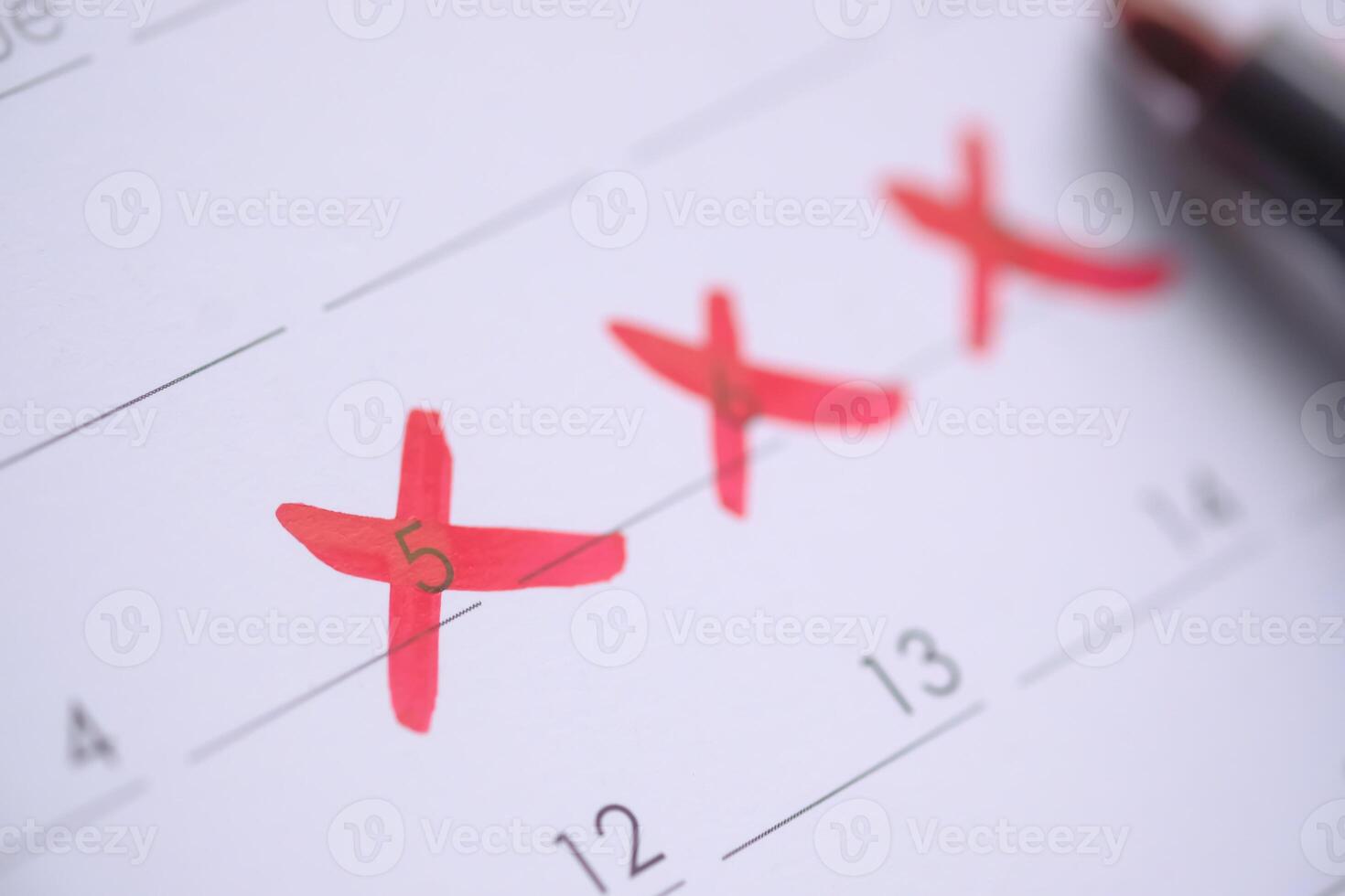 The Calendar is Marked with Red Crosses Indicating Important and Significant Dates photo