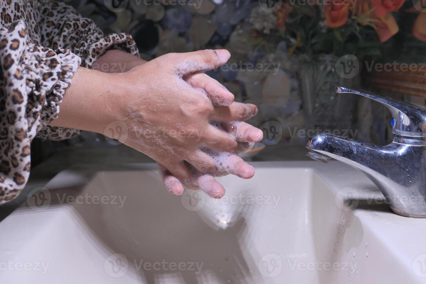 Washing Hands Thoroughly with Soap at the Sink for Effective Cleanliness and Hygiene photo
