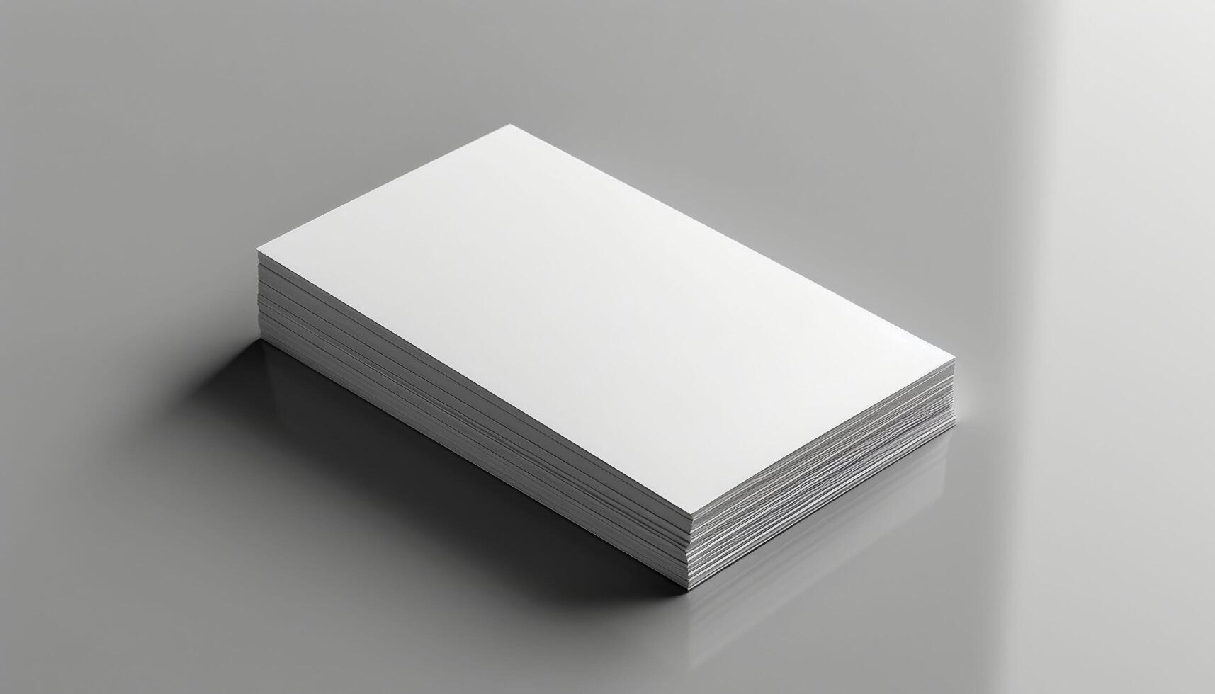 A stack of white business cards sits on a table photo