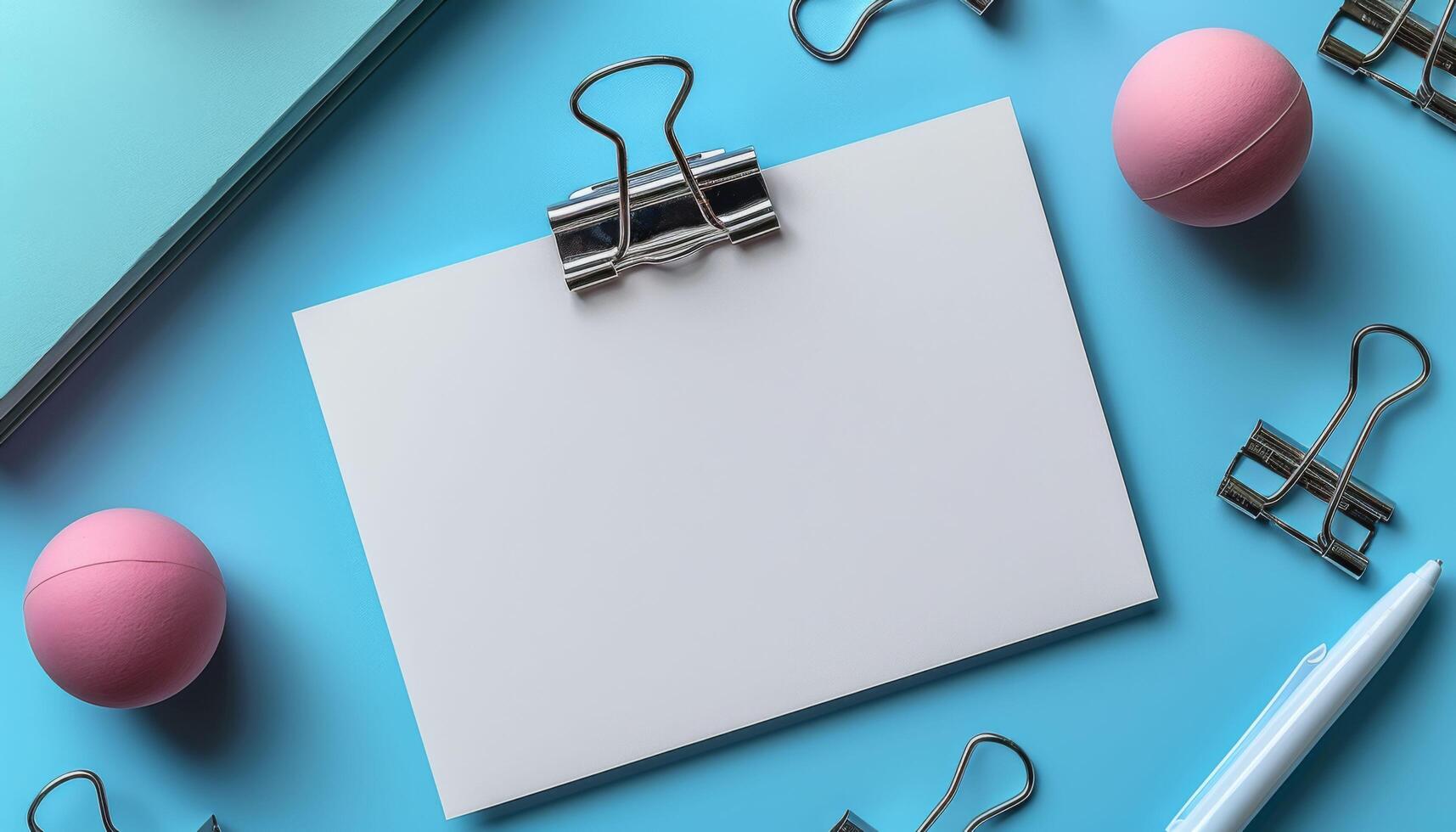 A white piece of paper with a clip on it and a pink ball on the right photo