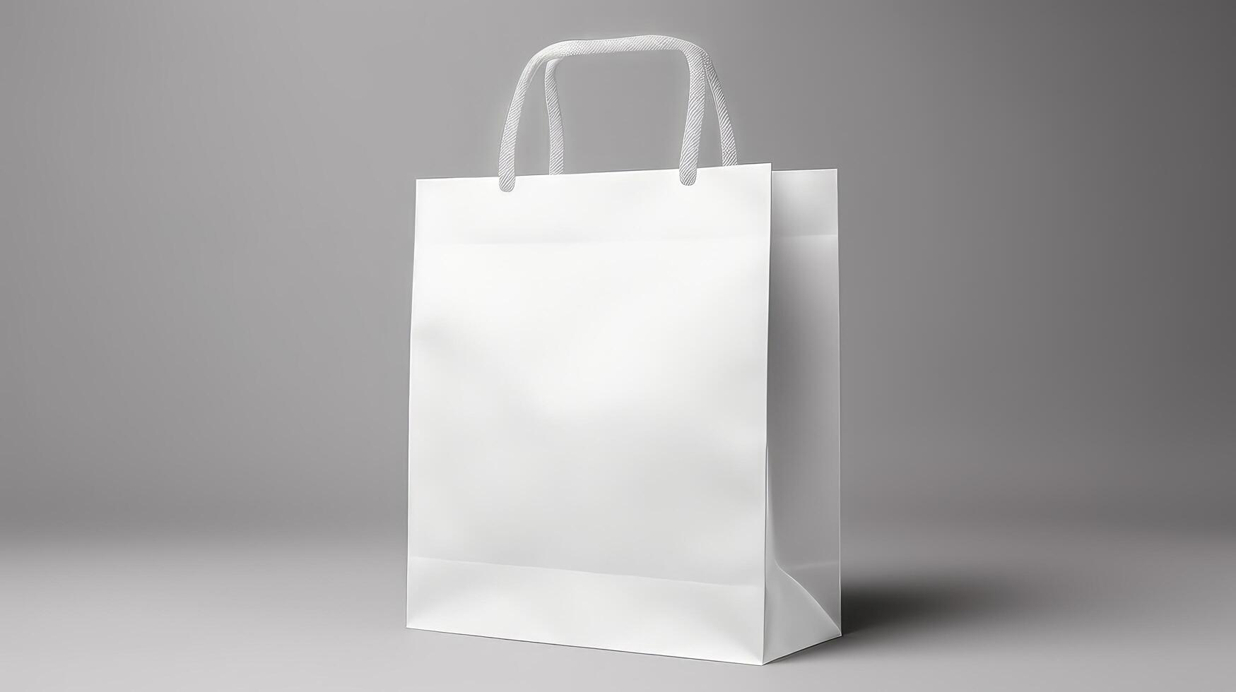 A white bag with a handle is sitting on a grey surface photo