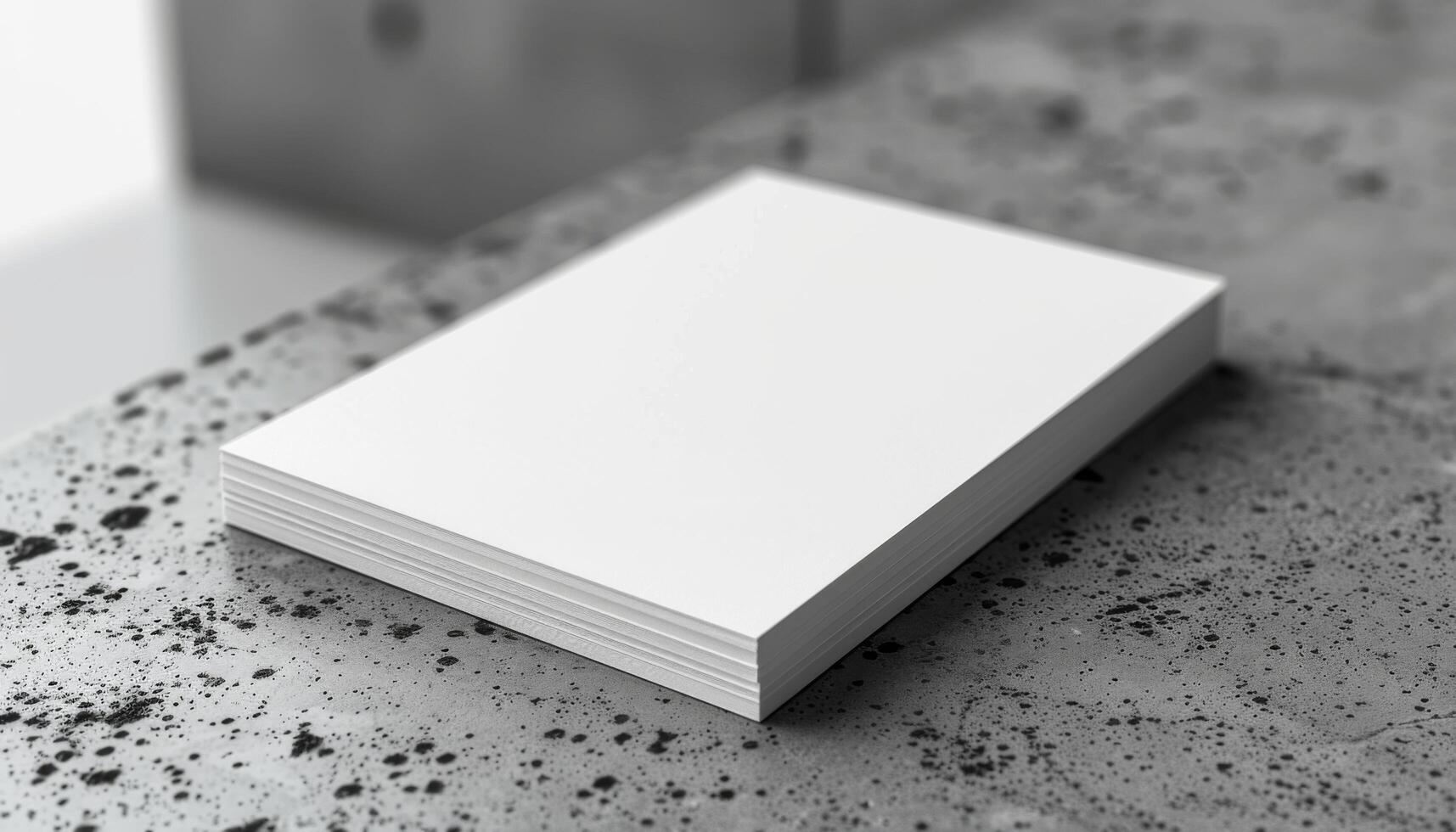 A white piece of paper sits on a table photo