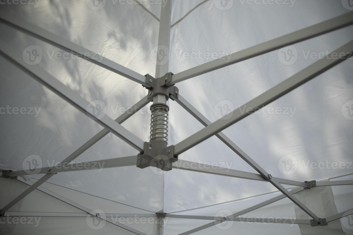 Tent construction. White tent. Tent roof. Mechanism for tensioning the fabric. photo