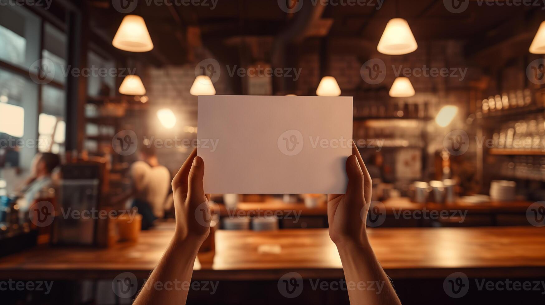 Two hands hold blank white card mockup in warm ambiance of cozy cafe. Blurred hanging lights. Pub bar menu template advertising image. Promotional mock up product photorealistic photo