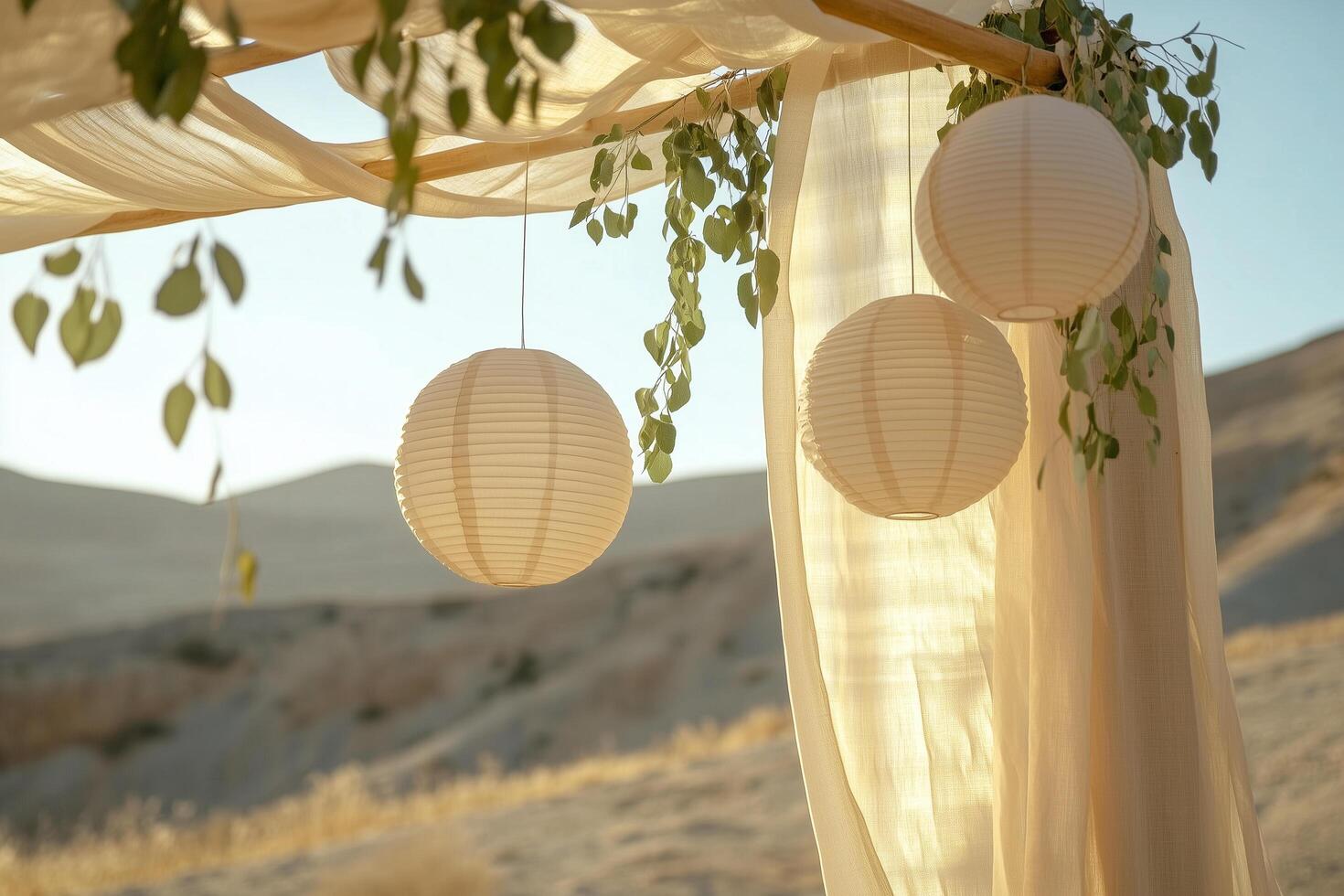 Wedding ceremony venue decorated with white paper lanterns and eucalyptus branches Sukkot photo