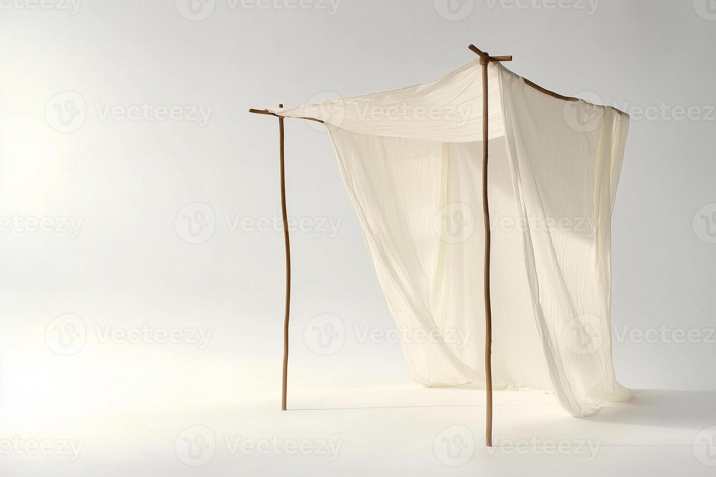 White canopy fabric blowing in the wind on white background sukkah photo
