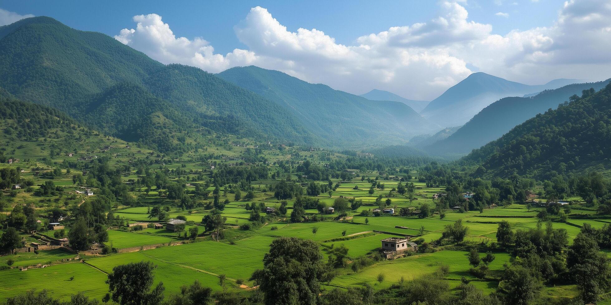 Sun shining on a valley full of rice fields and houses in the himalayas photo
