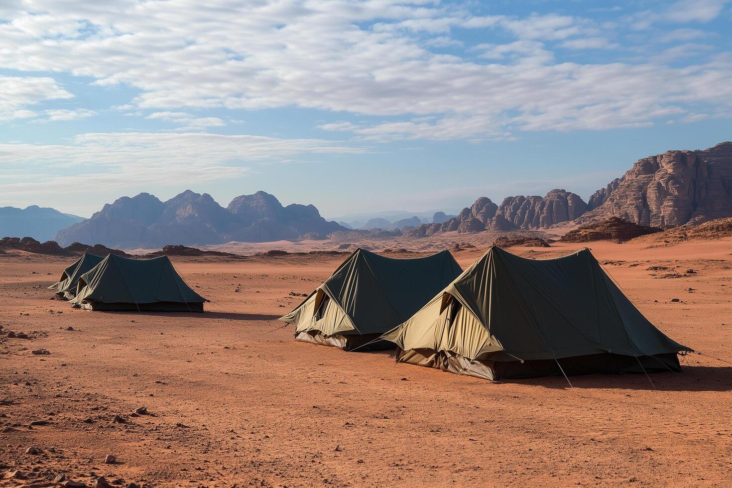 Tents camping under cloudy sky in wadi rum desert photo